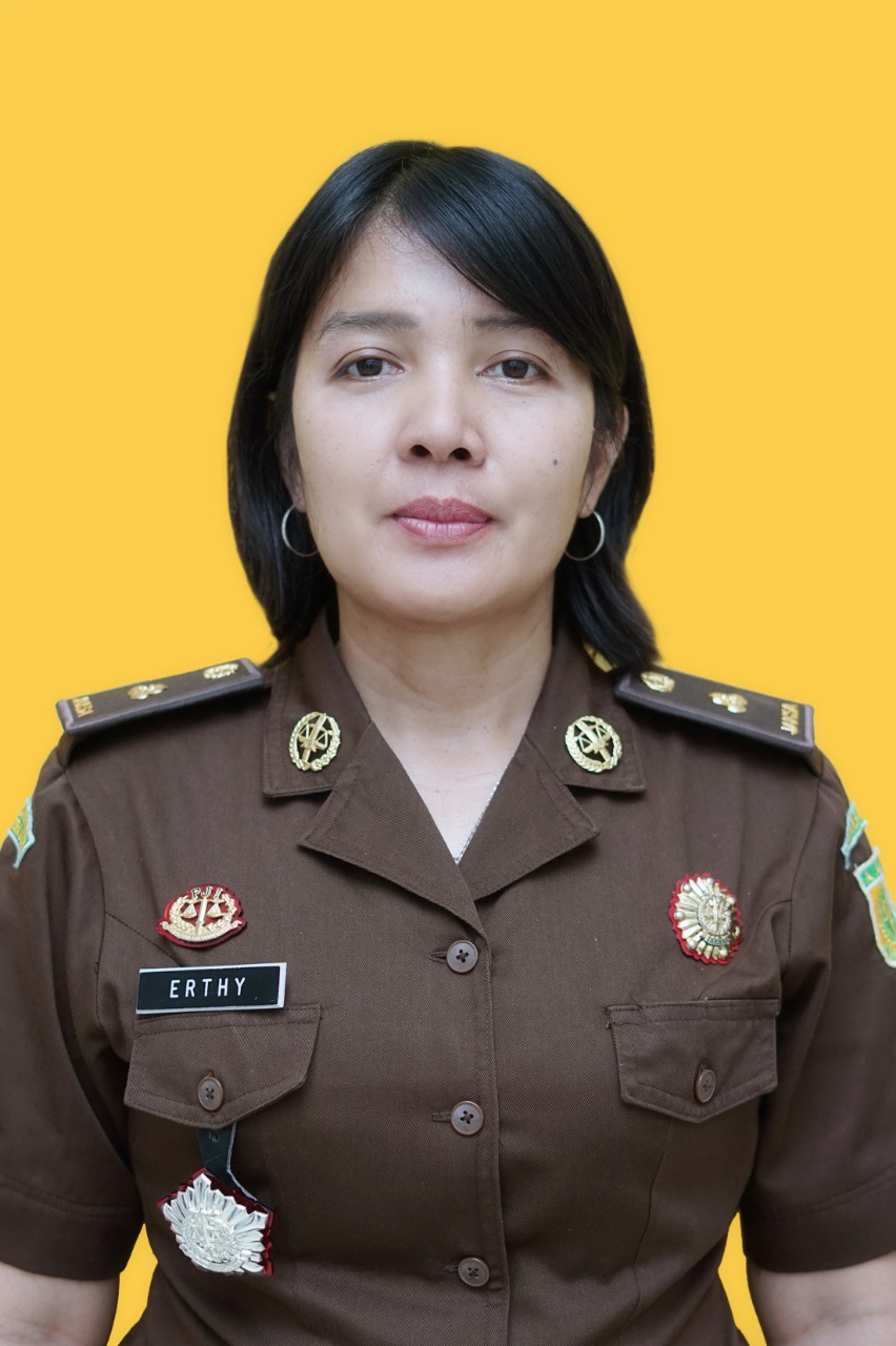 Erthy P.E. Simbolon, SH